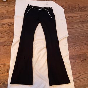 Black bellbottoms with silver button detailing